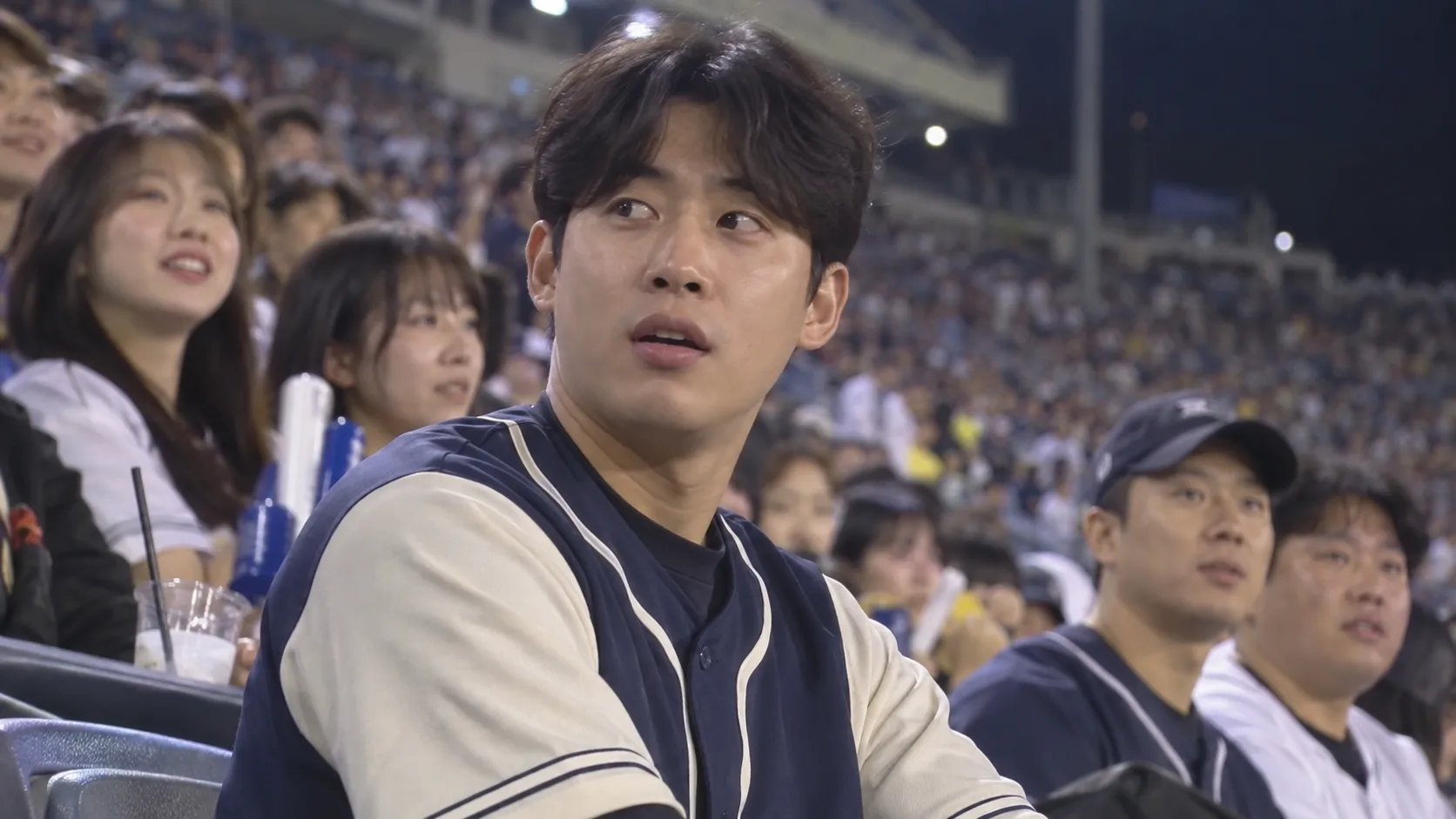 AI-generated male baseball fan in a stadium crowd, suitable as an image-to-video starting frame