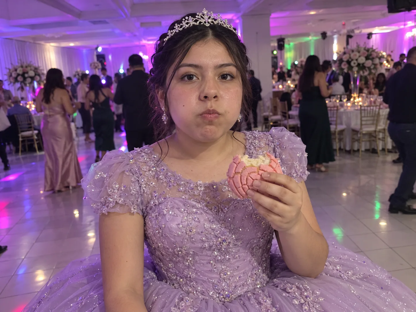 A quinceañera girl in a sparkling lilac ball gown and tiara holds a bitten pink concha and stares into the lens while guests dance behind her, a party dime dime baby AI dance clip